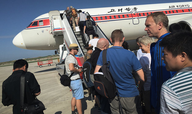 In this Saturday, June 27, 2015, photo, passengers board an Air Koryo plane at the Pyongyang International Airport, in Pyongyang, North Korea. Air Koryo is the only carrier to have been awarded just one star in rankings released recently by the UK-based SkyTrax consultancy agency. (AP Photo/Wong Maye-E)