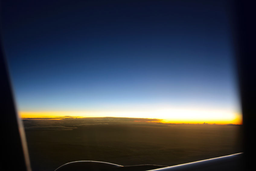 43348078 - airplanes window seat view with sunsetsunrise